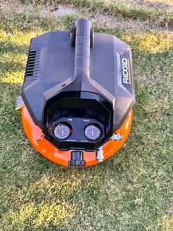 RIDGID 6 Gal. 150 PSI Portable Electric Oil-Free Jobsite Pancake Air Compressor with Dual Pressure Gauges and 2-Quick Couplers