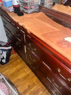 Up for grabs a  wooden  mirror and dresser combo .