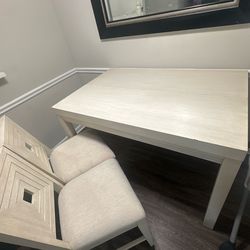 Dining table with two matching chairs