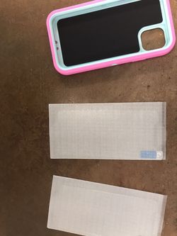 NewCaver and two screen protector never used I phone 11pro