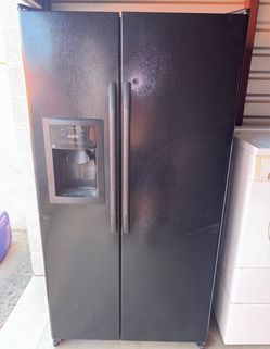 Black GE Refrigerator And Freezer