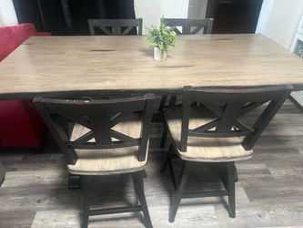 Table and 6 swivel chairs delivery available