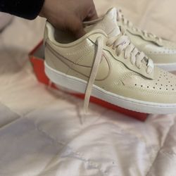 women's Nike Court Vision Low Premium sneakers in a pearl white colorway.  