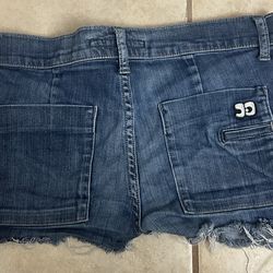 Joe's Jeans blue jean shorts with a frayed hem and five-pocket design