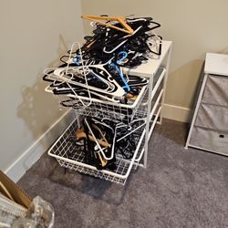 Pile Of Metal , Plastic And Velvet Hangers