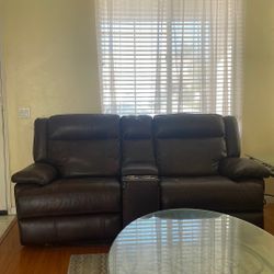 leather couch that has recliners