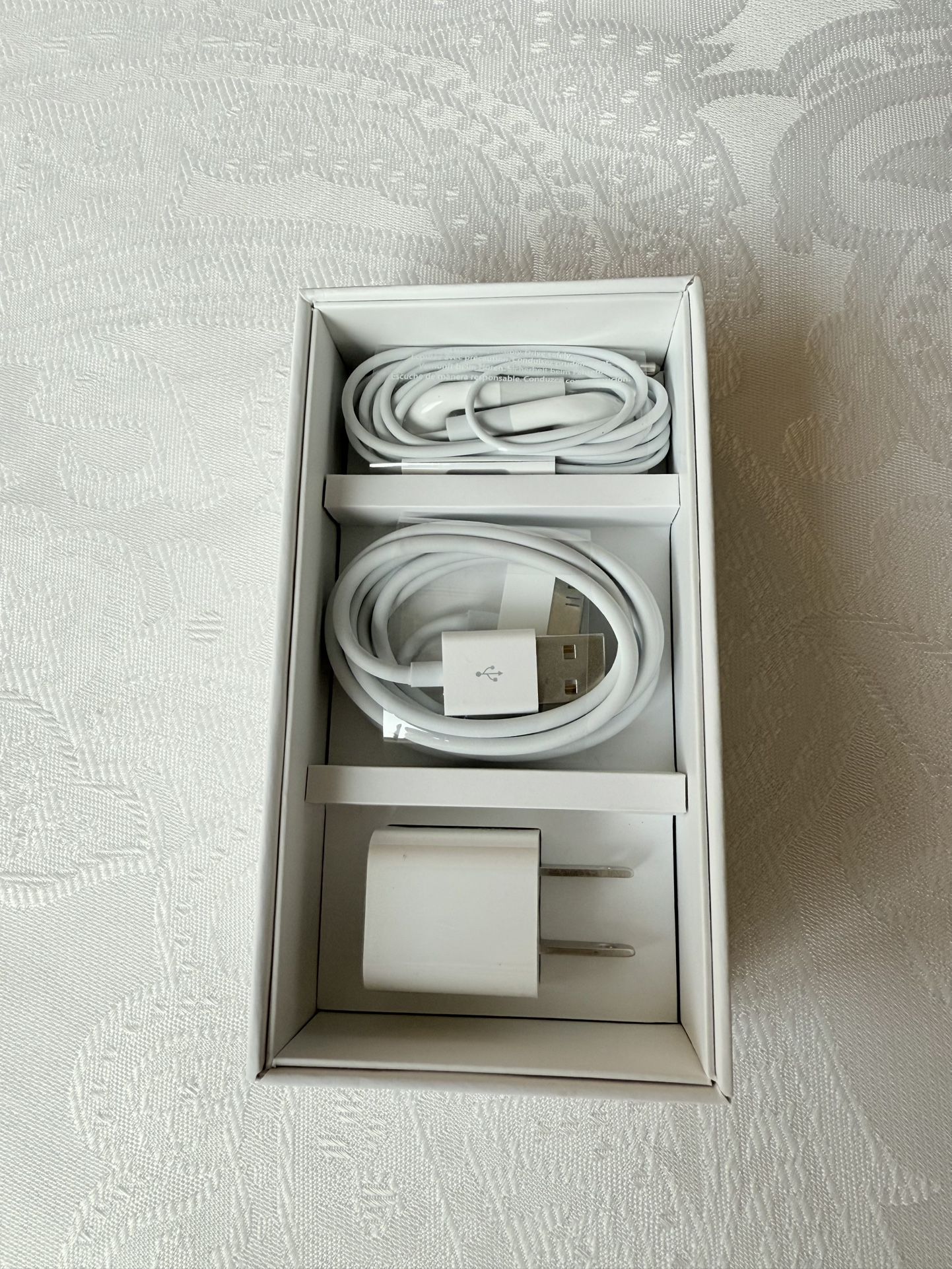Genuine Apple I-phone 4 accessories. Earphones with Remote and Mic; Dock Connector to USB Cable; and USB Power Adapter. Supports UMTS/HSDPA/HSUPA (850