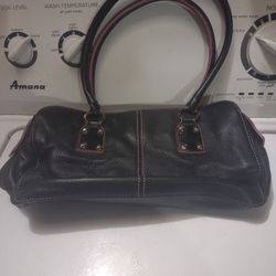 Black Leather Purse With Black Leather Tassels On The Zipper The Inside Of The Purse Is Pink 