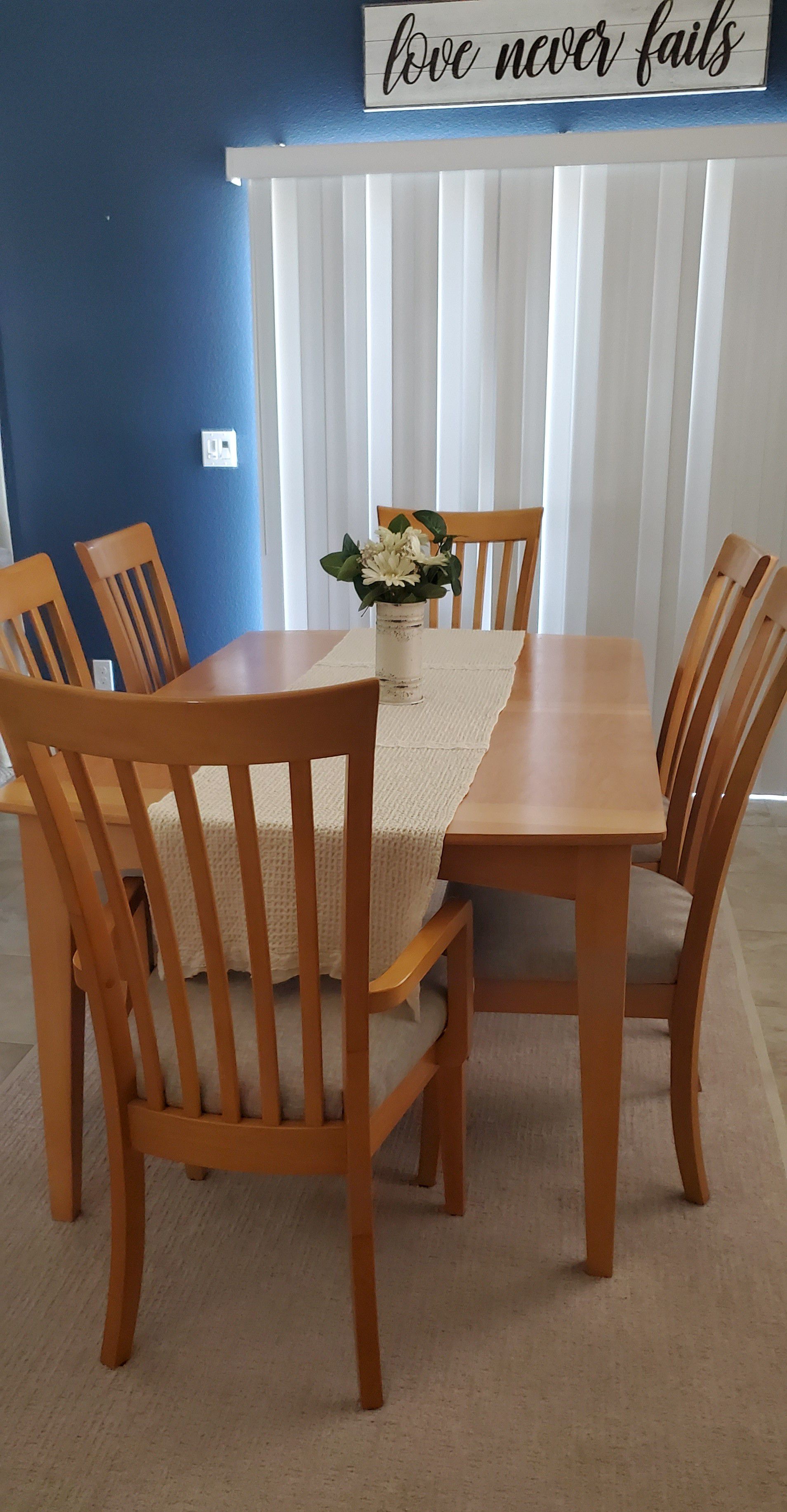 Solid maple table with new recovered chairs in modern fabric with another leaf
