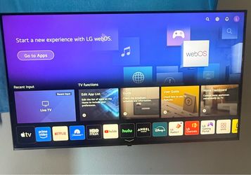 Smart LG 55-inch 4K television with remote, legs, and wall mount