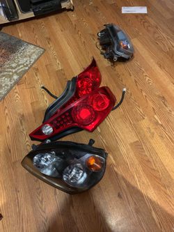 INFINITI G35 HEADLIGHTS AND TAILLIGHTS OEM.