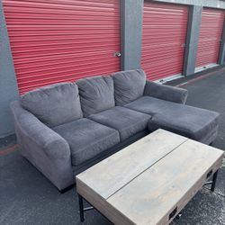 Ashely Furniture Reversible Grey L Couch (FREE DELIVERY) with coffee table