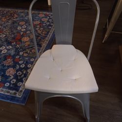 Metal Chairs And White Cushions