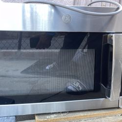NEW GE stainless steel over the stove microwave 