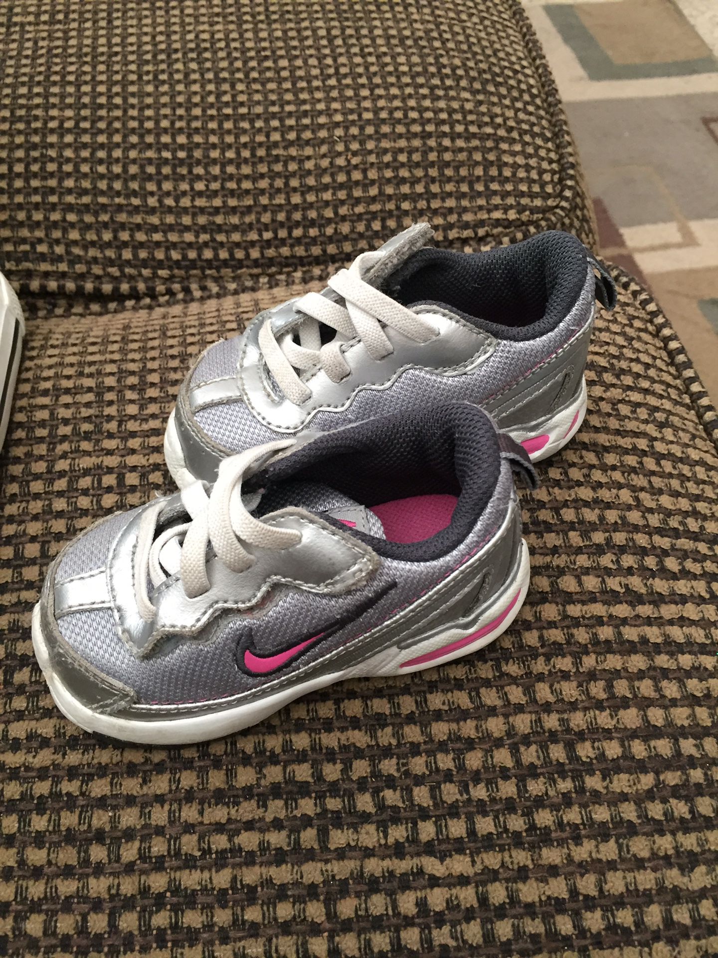 Size 4 grey and pink Nike shoes