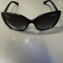 These are Vogue Eyewear sunglasses, model VO5155-S (often listed as VO5155S), a women’s full-rim rectangular/cat-eye style frame. Key Details from Mar