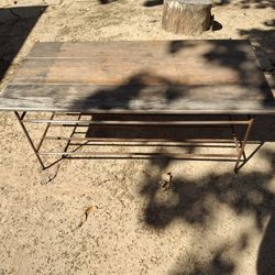 Steel base wood top coffee table