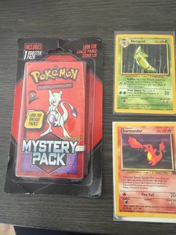 Pokémon Trading Card Game Mystery Pack Includes 1 Booster Pack Mewtwo and two old cards.