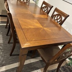 Wooden dining table with chairs