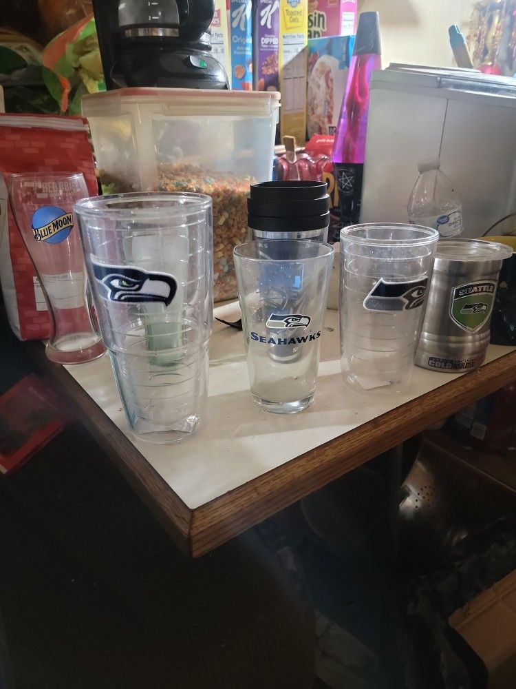 11 Seahawk Glases 3 Seahawk shot glasses.2 old Coke glasses one Killer .Batman Coffe Mug And one blue moon cook