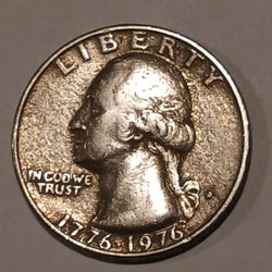 1776 To 1976 Bicentennial Quarter.   Very Good Condition.  Has an indentation or ridge all around the outside edge.   