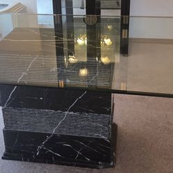 Dinning table marble base with glass top.