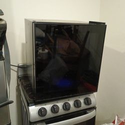 Black Mini Fridge. Like New 130.obo