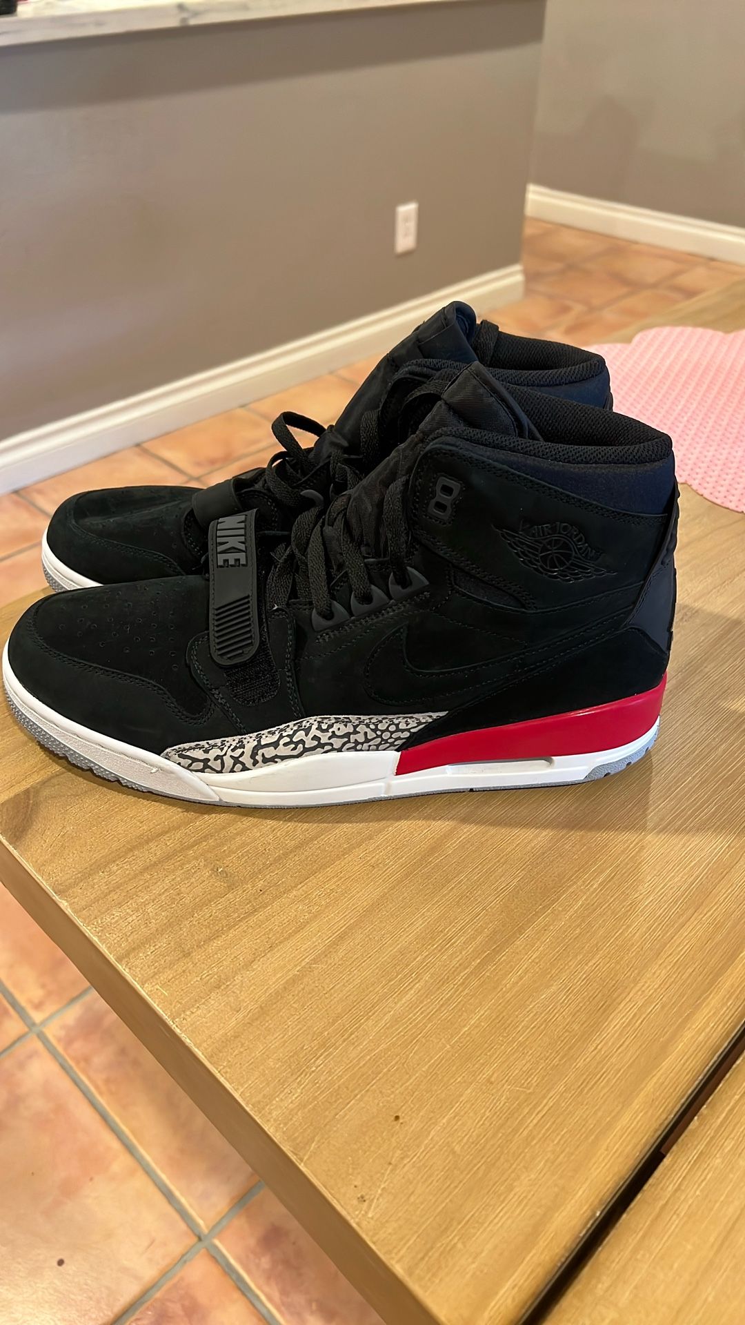 Air Jordan This is a pair of Jordan Legacy 312 "Black Suede" sneakers.