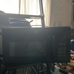 A Black Ge Over The Range Microwave