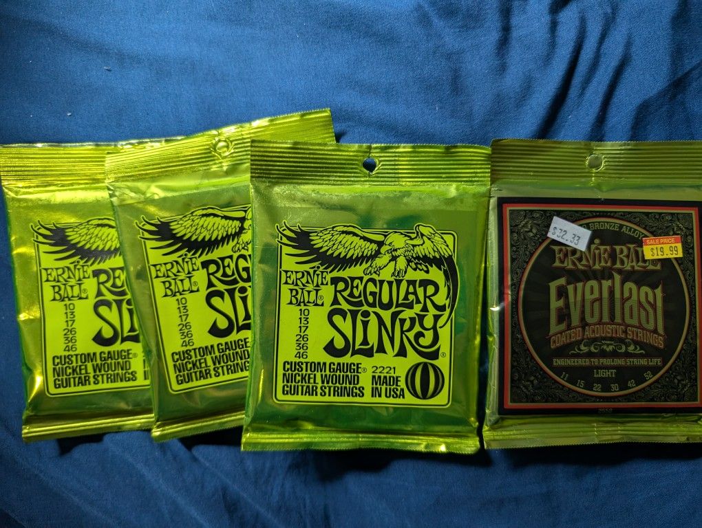 Guitar strings 3 Ernie Ball 10s and acoustic Set