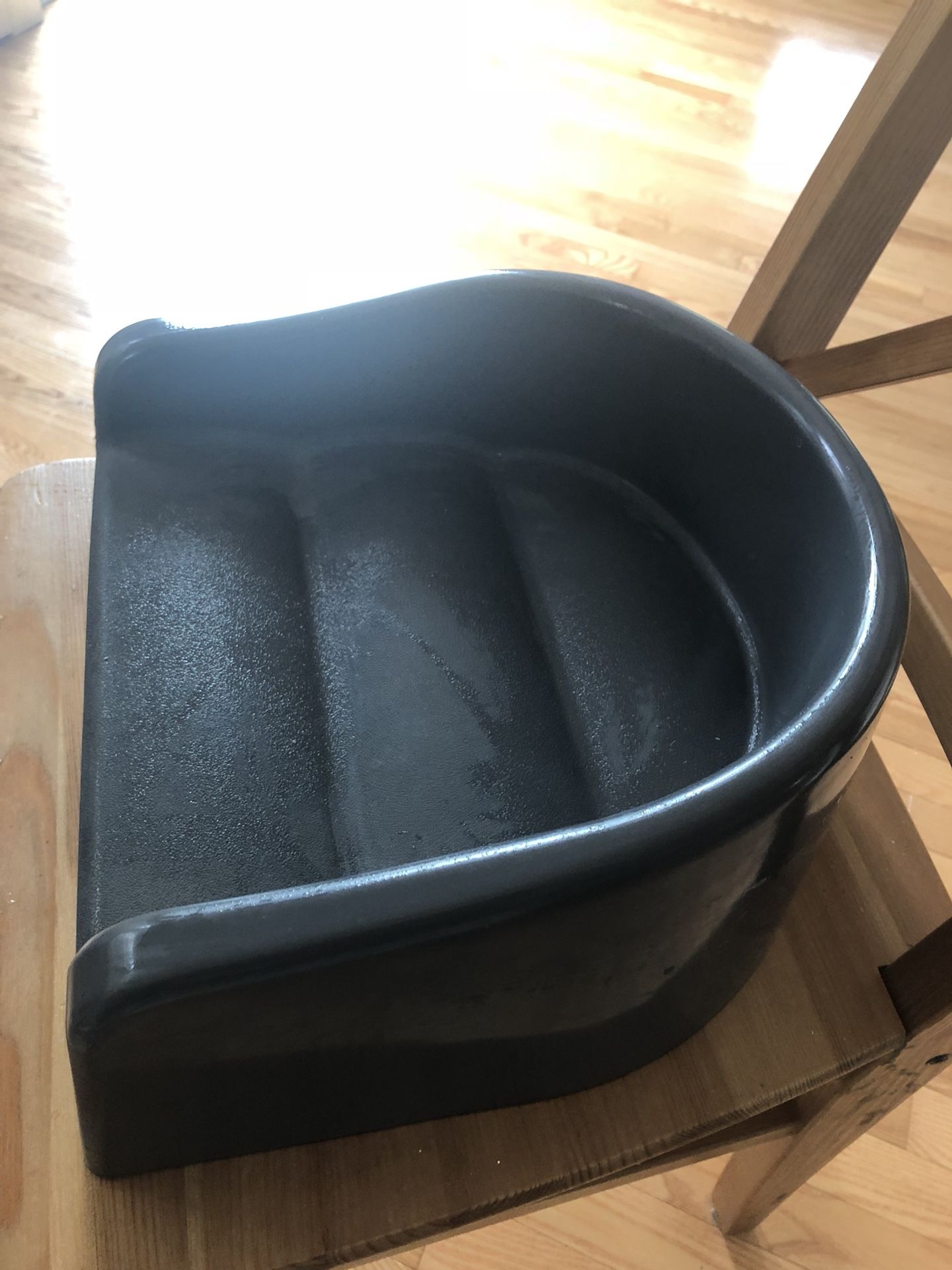 gray booster seat for a dining chair