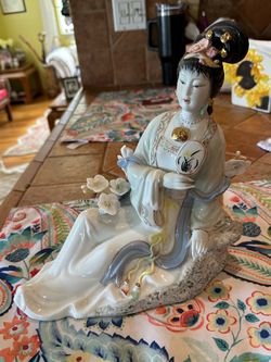 Dressed porcelain geisha