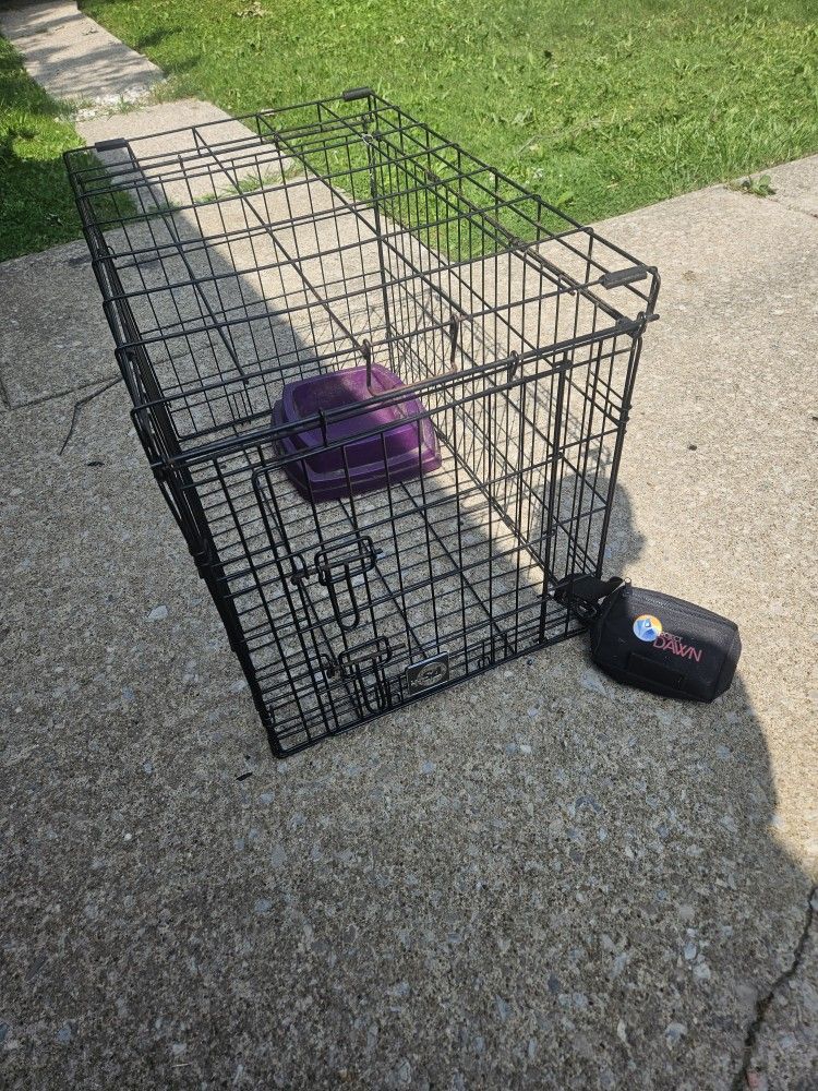Metal wire dog cage.
