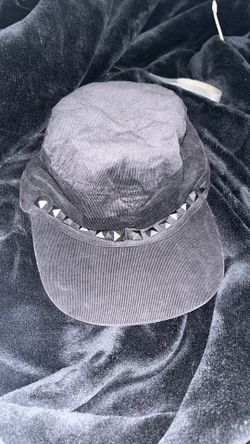 black corduroy studded hat with purple silk fabric on the inside