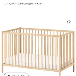 Ikea SNIGLAR crib Beech Good Condition Crib Mattress, Used For One Baby, But The Plastic Covering Tore On One Side