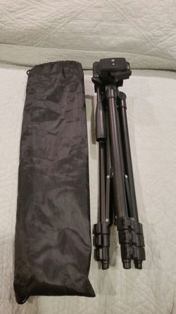 Lightweight camera tripod with bag.