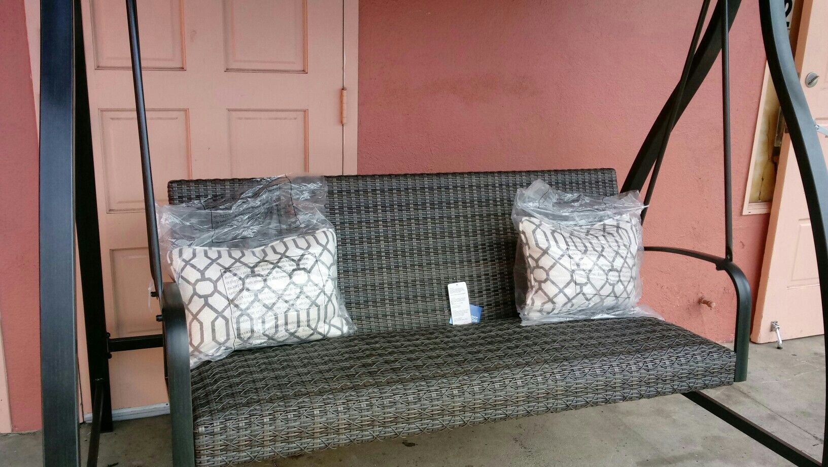 Agio eastport woven swing with canopy and accent pillows sales