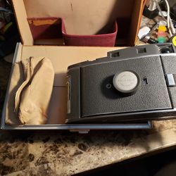Vintage Polaroid camera and leather case
