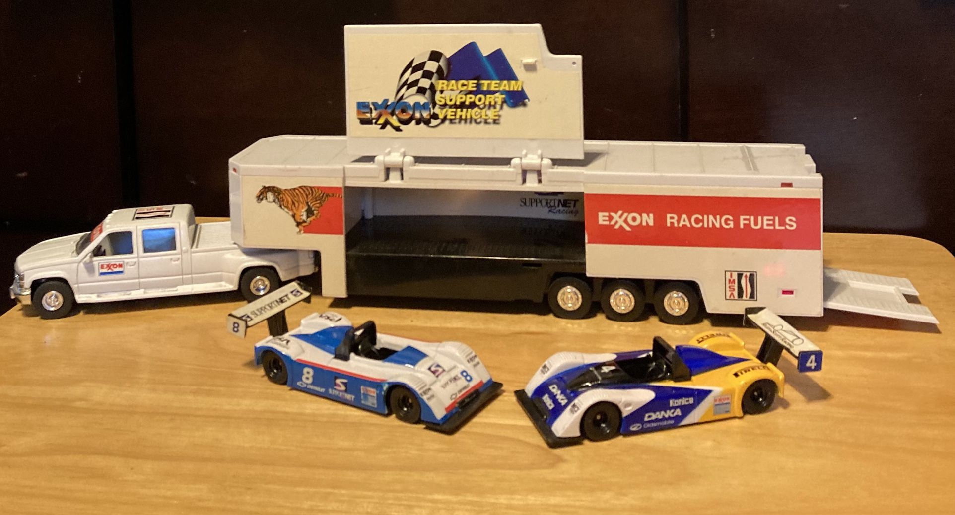 EXXON RACING RELY ON THE TIGER RACE CAR HAULER WITH LIGHTS AND SOUNDS.