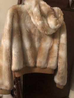 These r two girls winter fur coats one is medium and one is large