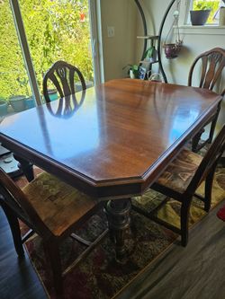 Antique dining room table with 6 chairs