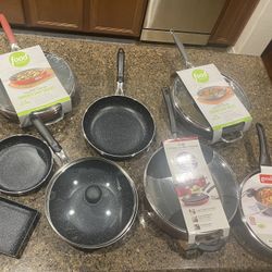 Brand new pots and pans set. $150 for all. Price is firm. :) Higley and ray. 
