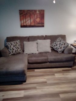 Very nice couch gray in color very comfy.