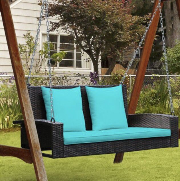 2 person wicker hanging porch swing with 2 back cushions and seat cushion.
