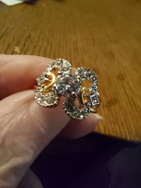 Brand New Zircon Gold Tone Ring. Size 4