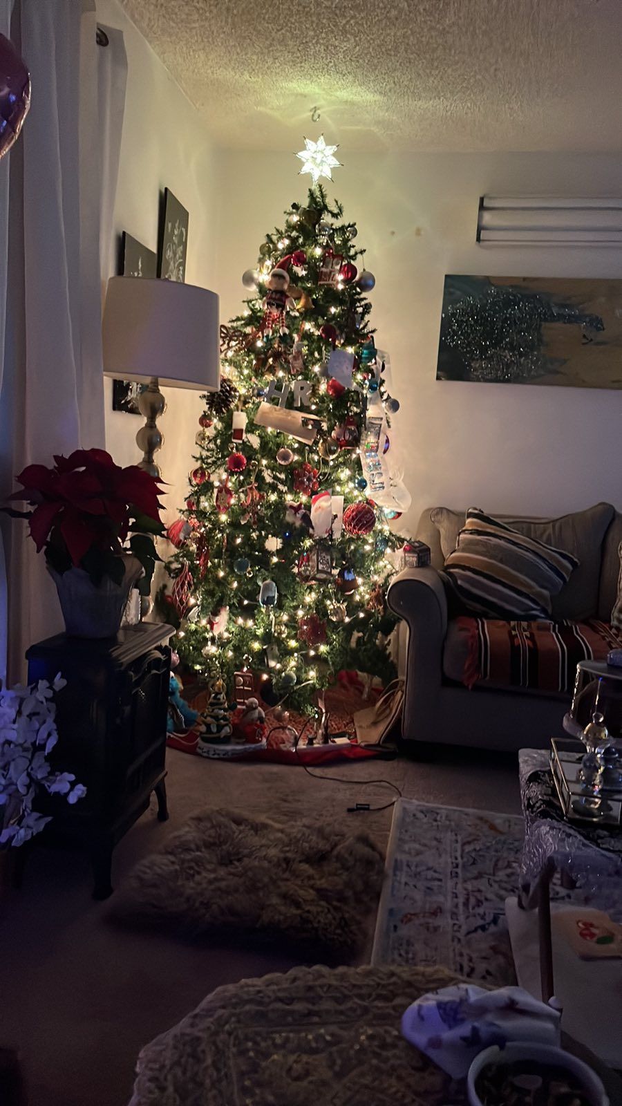 Large Christmas tree that reaches the ceiling. Sold with lights only.