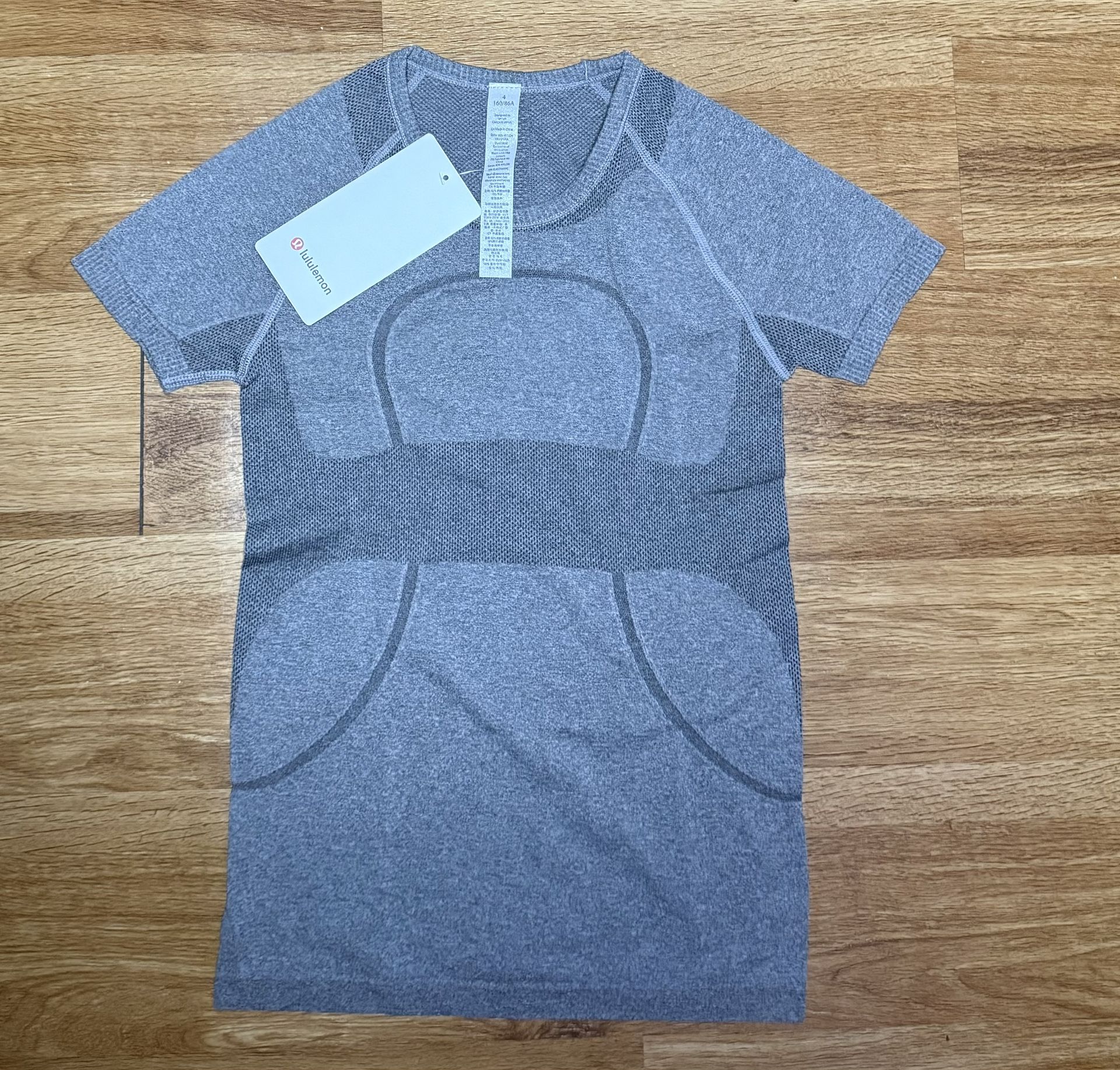 Swiftly Tech short sleeve “Waist Length” . Size M