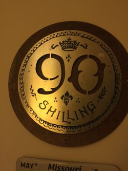 Odell's 90 shilling tin bar sign
