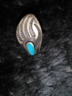 Turquoise bear claw ring.