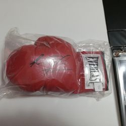 Signed Riddick Bowe Glove With Beckett COA.